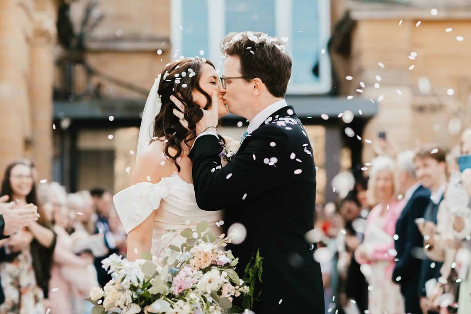 Couple embracing while the band plays behind them